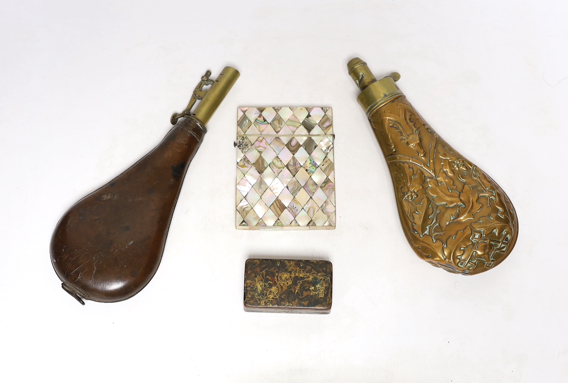 A Victorian embossed brass powder flask, a leather shot flask and a Victorian mother of pearl and abalone calling card case